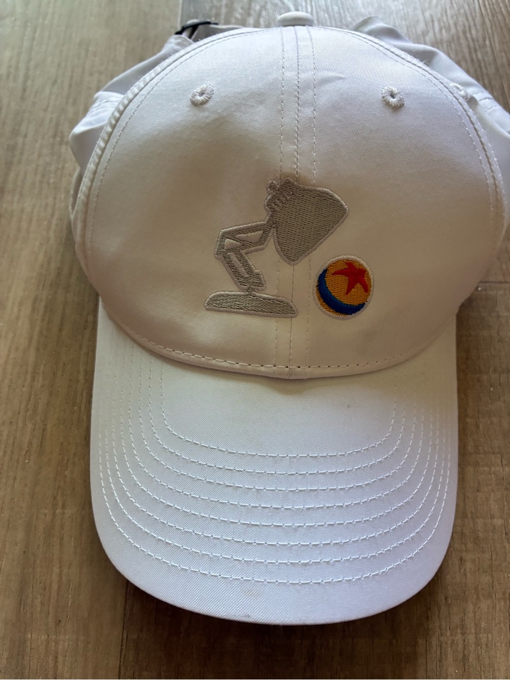 Nike White Baseball Cap with Embroidered Pixar Lamp